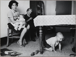 Mother Breastfeeding one Child while another is under the Table, Sicily